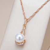 Drop-shaped necklaces with single pearl and zircons in 18K Rose Gold Plating