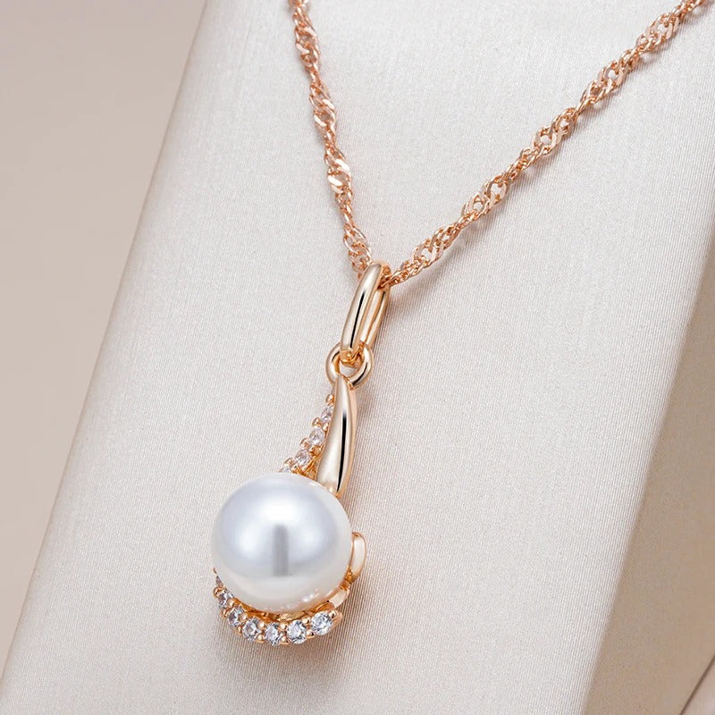 Drop-shaped necklaces with single pearl and zircons in 18K Rose Gold Plating