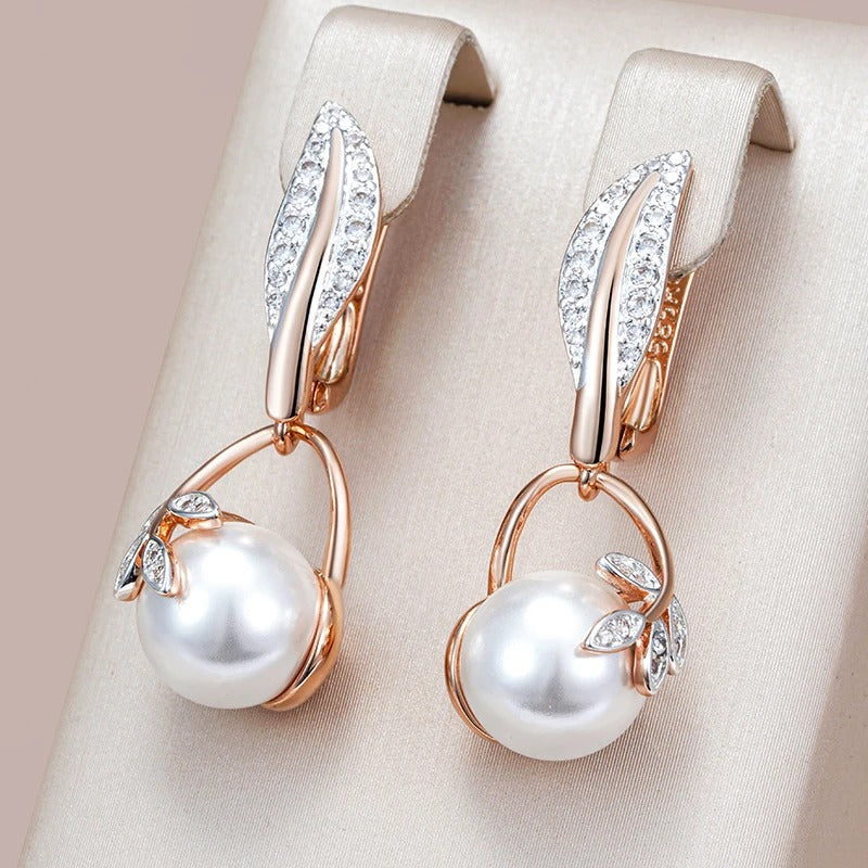 Earrings with pearl pendant and white zirconia leaves in 18K rose gold plating