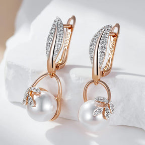 Earrings with pearl pendant and white zirconia leaves in 18K rose gold plating