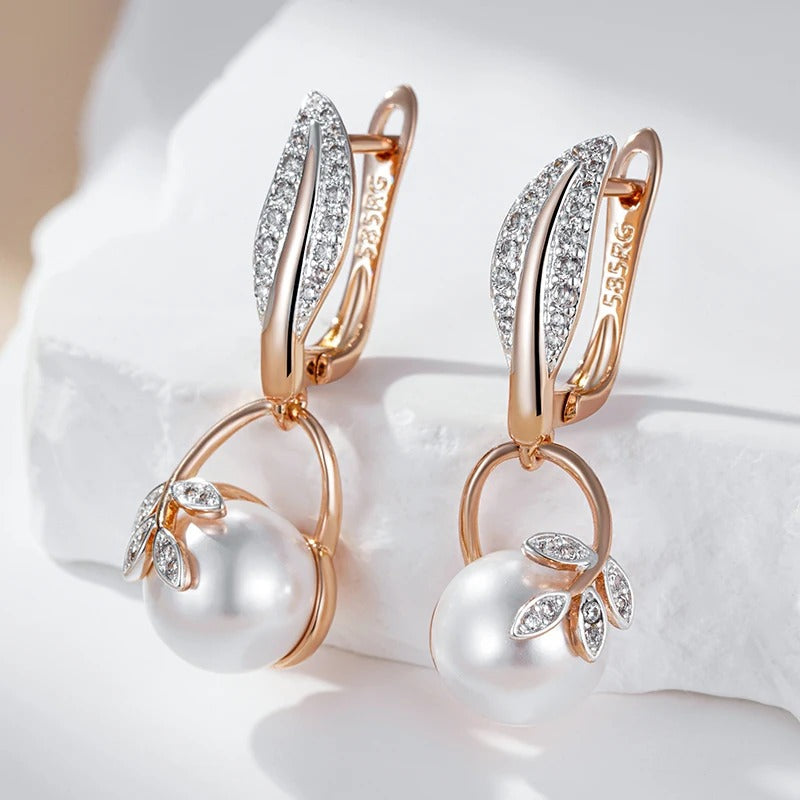 Earrings with pearl pendant and white zirconia leaves in 18K rose gold plating