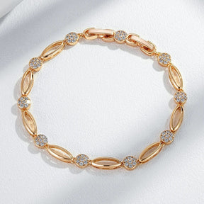Fine bracelete of oval figures and white zirconias in 18K rose gold plating