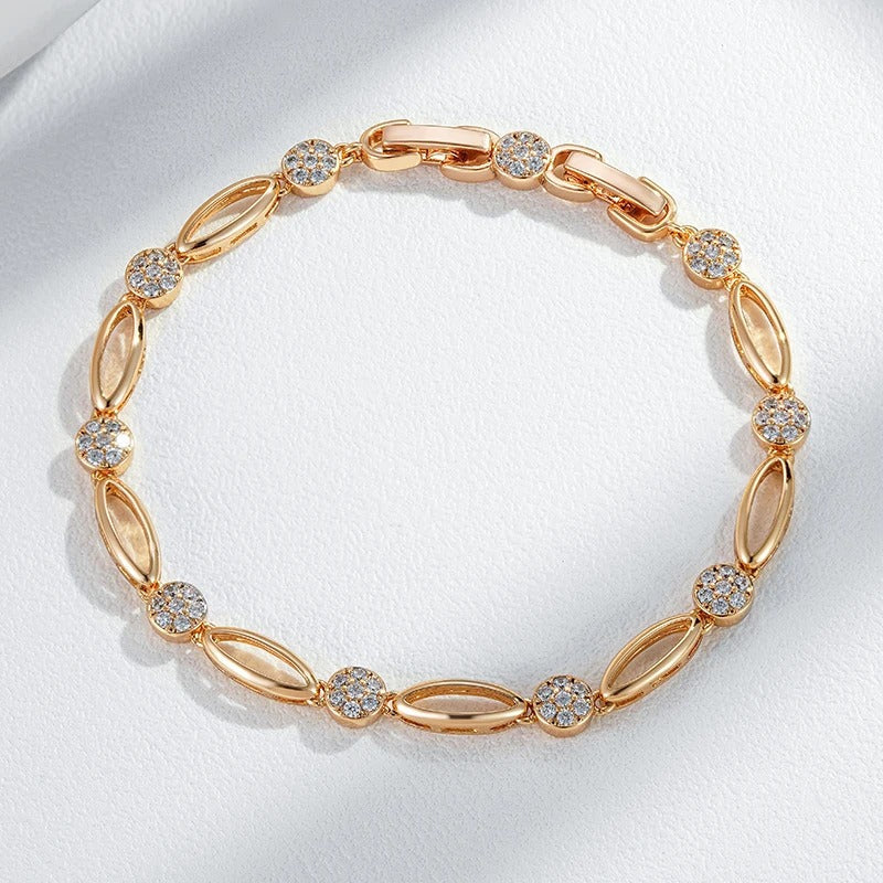 Fine bracelete of oval figures and white zirconias in 18K rose gold plating