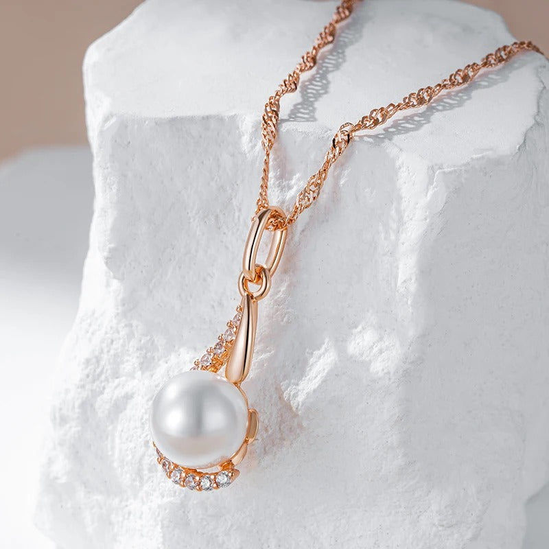 Drop-shaped necklaces with single pearl and zircons in 18K Rose Gold Plating