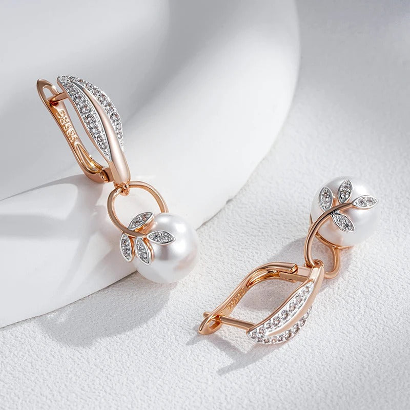 Earrings with pearl pendant and white zirconia leaves in 18K rose gold plating