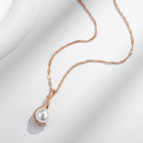 Drop-shaped necklaces with single pearl and zircons in 18K Rose Gold Plating