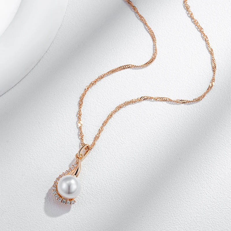 Drop-shaped necklaces with single pearl and zircons in 18K Rose Gold Plating
