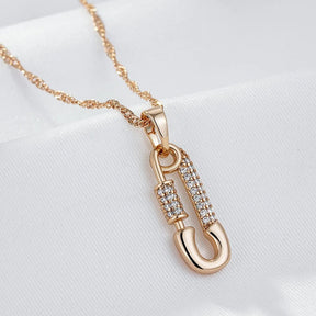 Pendant necklace with pin shape and zircons in 18K Rose Gold Plated