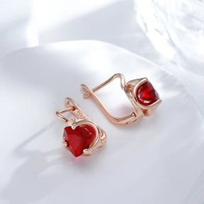 Stud earrings with ruby zirconia in 18K rose gold plating