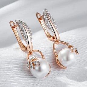 Earrings with pearl pendant and white zirconia leaves in 18K rose gold plating