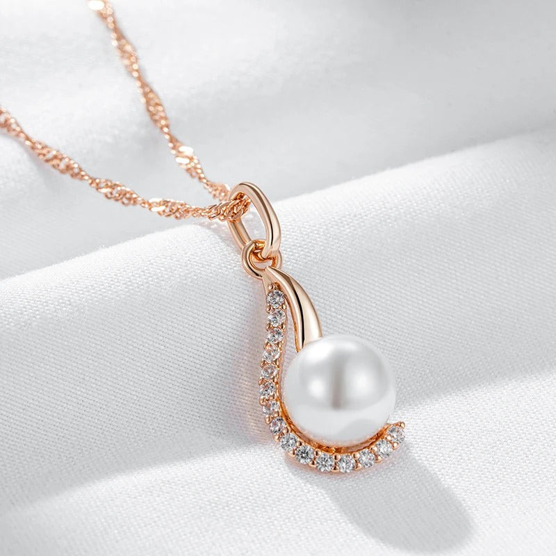 Drop-shaped necklaces with single pearl and zircons in 18K Rose Gold Plating